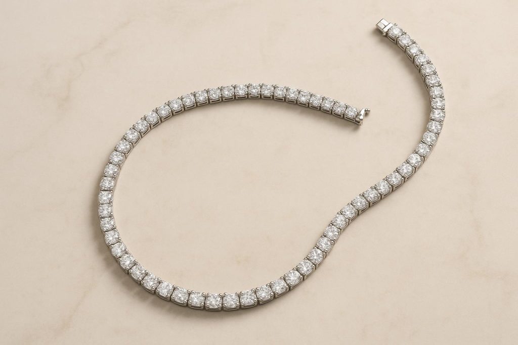 Close-up of a diamond tennis necklace showcasing round brilliant stones and classic clasp design